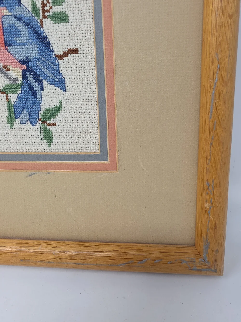 Framed Four-Panel Bird Cross-Stitch Wall Art in Blue, Pink & Green
